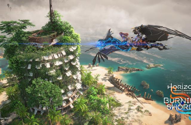 Aloy flies above a ruined tower on top of a Sunwing, a pterodactyl-like robot. Below the tower, there are palm trees, a sandy shore and tropical waters. 