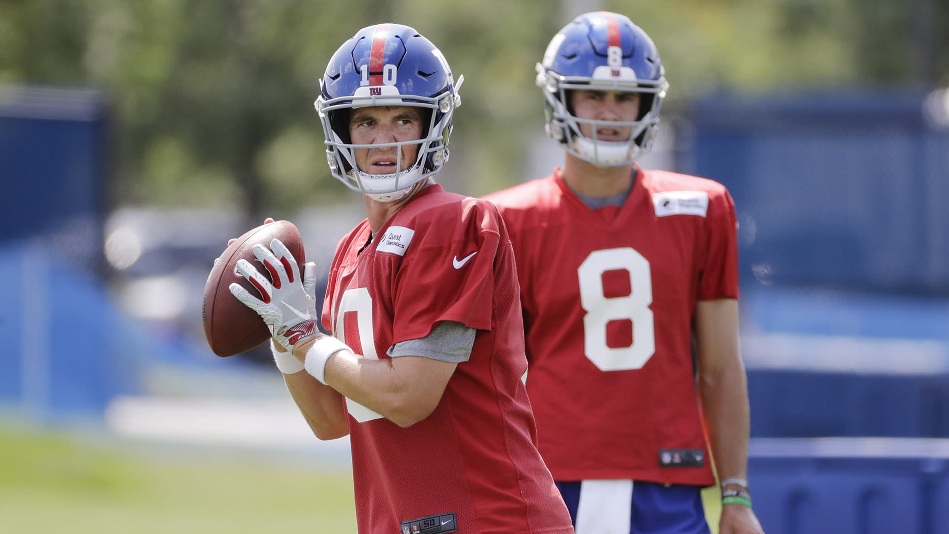 New York Giants Eli Manning and Indianapolis Colts Peyton Manning exchange  words while walking off of the field in week 1 at Giants Stadium in East  Rutherford, New Jersey on September 10