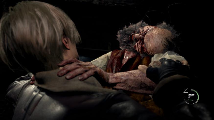 A close-up shot of an infected, bloody villager attacking Leon, the protagonist of Resident Evil 4.
