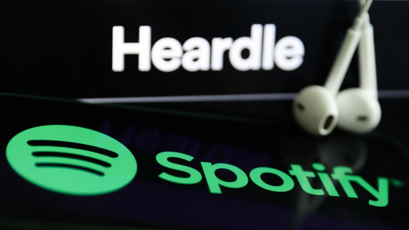 Heardle logo displayed on a laptop screen, Spotify logo displayed on a phone screen and headphones are seen in this illustration photo taken in Krakow, Poland on July 12, 2022. (Photo by Jakub Porzycki/NurPhoto via Getty Images)