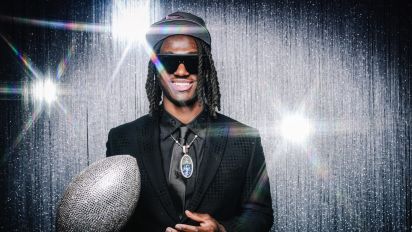 Getty Images - DETROIT, MI - APRIL 25: (EDITOR'S NOTE: Image has been taken using a Star Effect Filter)  Wide receiver Marvin Harrison Jr. poses for portraits after being selected fourth overall in the first round by the Arizona Cardinals during the 2024 NFL draft on April 25, 2024 in Detroit, Michigan. (Photo by Todd Rosenberg/Getty Images)