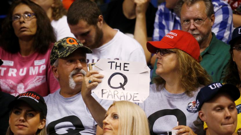 A supporter holds a QAnon sign as U.S. President Donald Trump addresses a campaign rally at Mohegan Sun Arena in Wilkes-Barre, Pennsylvania, U.S., August 2, 2018. REUTERS/Leah Millis