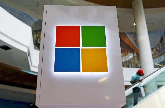 A Microsoft logo is seen at a pop-up site for the new Windows 10 operating system at Roosevelt Field in Garden City, New York July 29, 2015. Microsoft Corp's launch of its first new operating system in almost three years, designed to work across laptops, desktop and smartphones, won mostly positive reviews for its user-friendly and feature-packed interface.