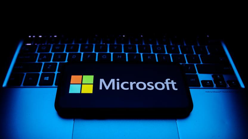 Microsoft logo displayed on a phone screen and a laptop keyboard are seen in this illustration photo taken in Krakow, Poland on October 30, 2021. (Photo by Jakub Porzycki/NurPhoto via Getty Images)