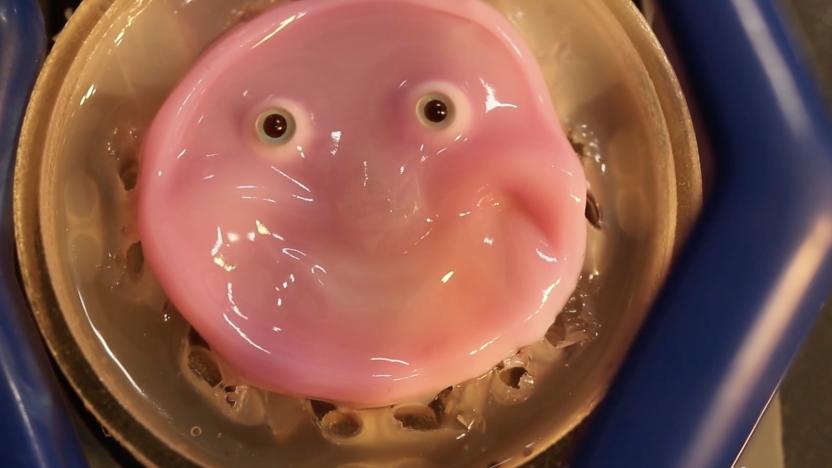 A smiling, smooth-looking pink blob with eyes.