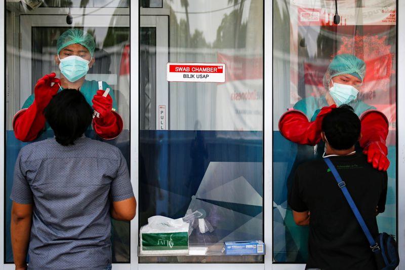 Indonesia sees new daily record 8,369 coronavirus cases