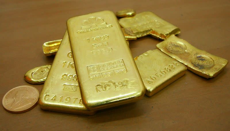 Gold slides to nine-month low as Powell's remarks make ...