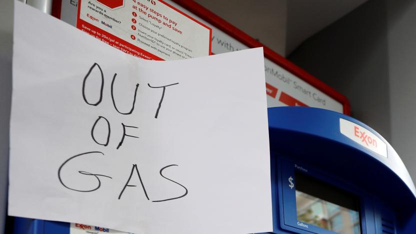 A sign is seen as Exxon station is out of gas after a cyberattack crippled the biggest fuel pipeline in the country, run by Colonial Pipeline, in Washington, U.S., May 15, 2021. REUTERS/Yuri Gripas