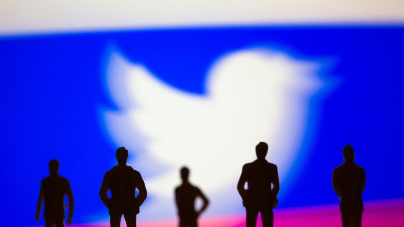 Small toy figures are seen in front of Twitter logo and Russian flag colours in this illustration picture taken March 15, 2021. REUTERS/Dado Ruvic/Illustration