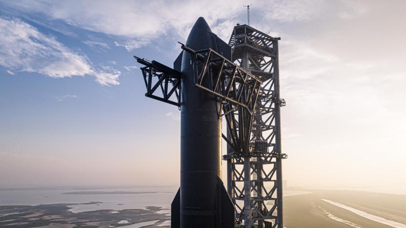 SpaceX's Starship vehicle attached to a launch tower with the sky in the background. 