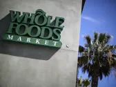 Whole Foods CEO says he is slashing prices on private-label food to battle supermarkets