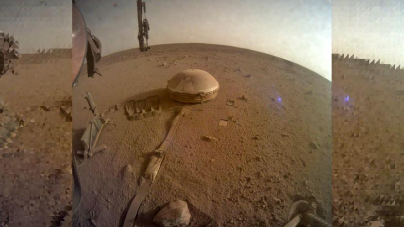 NASA InSight final image December 2022 showing the edges of its base and a small domed device a few feet away connected by a cable.