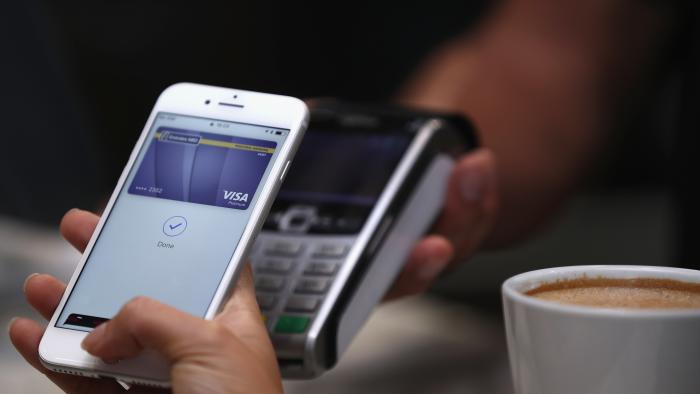 DUBAI, UNITED ARAB EMIRATES - OCTOBER 22:  A customer makes a transaction using Apple Pay in the UAE at The Dubai Mall on October 22, 2017 in Dubai, United Arab Emirates.  (Photo by Francois Nel/Getty Images)