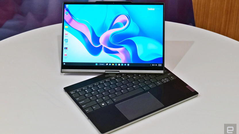 The Lenovo ThinkBook Plus laptop with a swivel monitor is seen on a white table with the display open and twisted to the side by 45 degrees