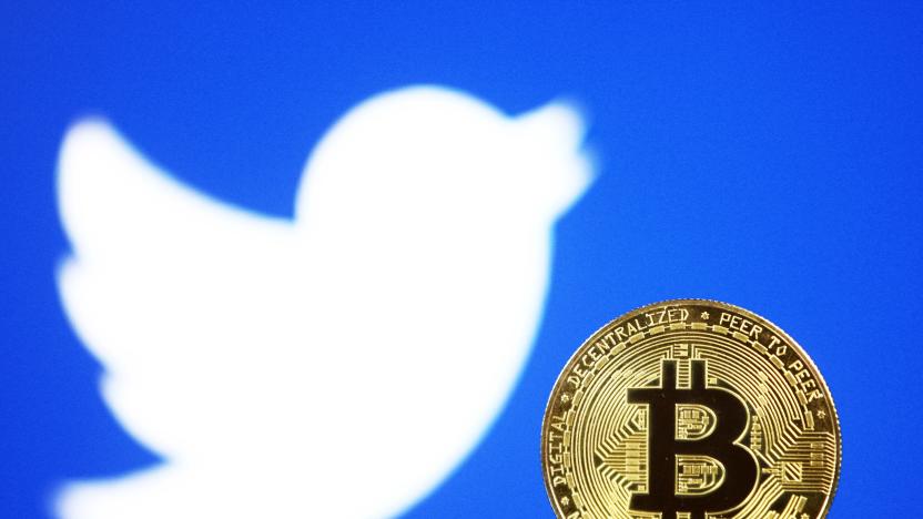 Bitcoin cryptocurrency coin and Twitter logo are pictured in this illustrative photo in Kyiv on 29 July, 2021.  (Photo by STR/NurPhoto via Getty Images)