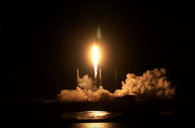 The NASA TEMPO launch seen at night from a distance, with the rocket blazing as it takes off.