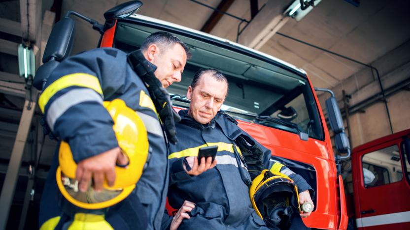 Firefighters using smart phone.