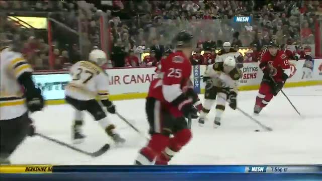 Brad Marchand dekes Senators defense to score