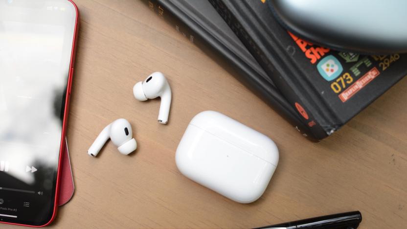 The Apple AirPods Pro laid on a desk with Cyber Monday logo.