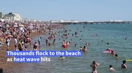 Crowds Flock To Brighton Beach As Temperatures Rise Up