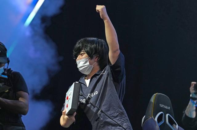 LAS VEGAS, NEVADA - AUGUST 07: "Kawano" celebrates after winning the grand championship of Street Fighter V: Champion Edition during EVO 2022 at Mandalay Bay Resort and Casino on August 07, 2022 in Las Vegas, Nevada. 