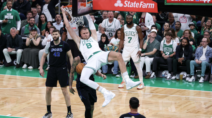 Getty Images - BOSTON, MASSACHUSETTS - JUNE 06: Kristaps Porzingis #8 of the Boston Celtics dunks the ball against Dereck Lively II #2 of the Dallas Mavericks during the first quarter in Game One of the 2024 NBA Finals at TD Garden on June 06, 2024 in Boston, Massachusetts. NOTE TO USER: User expressly acknowledges and agrees that, by downloading and or using this photograph, User is consenting to the terms and conditions of the Getty Images License Agreement. (Photo by Adam Glanzman/Getty Images)