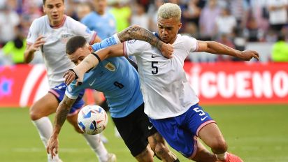 Getty Images - KANSAS CITY, MISSOURI - JULY 01: Antonee Robinson #5 of the United States battles for the ball with Nahitan Nandez #8 of Uruguay during the first half at GEHA Field at Arrowhead Stadium on July 01, 2024 in Kansas City, Missouri. (Photo by Bill Barrett/ISI Photos/USSF/Getty Images for USSF)