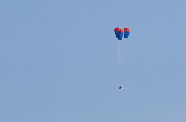 The space capsule of Blue Origin's rocket New Shepard, carrying six crew members, is seen before landing, on billionaire Jeff Bezos's company's fourth suborbital tourism flight, near Van Horn, Texas, U.S., March 31, 2022. REUTERS/Ivan Pierre Aguirre