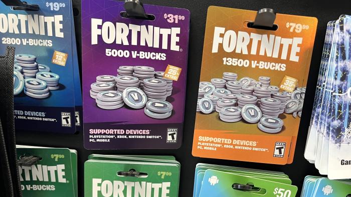 Fortnite V-Bucks are offered for sale at a video game retailer on December 19, 2022 in Chicago, Illinois. Epic Games, the maker of Fortnite, has been ordered by the Federal Trade Commission to pay $520 million to settle allegations that it collected personal data from children without the consent of a parent or guardian. 