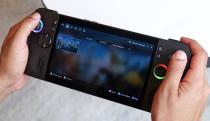 The ASUS ROG Ally X gaming handheld in two hands.