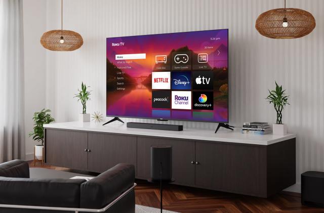 Roku Plus TV in a living room on a console table.