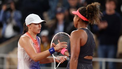Getty Images - PARIS, FRANCE - MAY 29: Iga Swiatek of Poland (L) shakes hands with Naomi Osaka of Japan after her victory in the Women's Singles second round match during Day Four of the 2024 French Open at Roland Garros on May 29, 2024 in Paris, France. (Photo by Clive Brunskill/Getty Images)