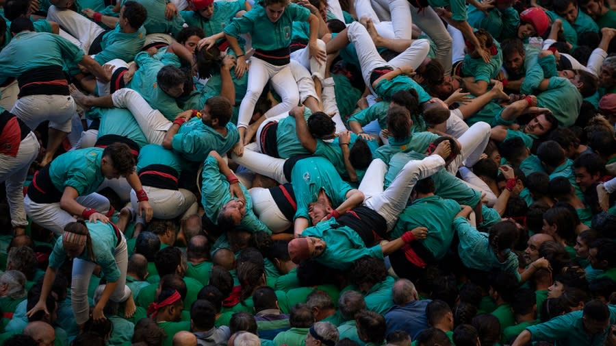 Photos of the Week: Human tower, home run record and a blessed rooster