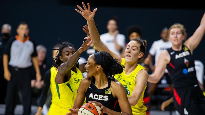 Oct 6, 2020; Bradenton, Florida, USA; Las Vegas Aces center A'ja Wilson (22) looks to pass as Seattle Storm forward Natasha Howard (6) and forward Breanna Stewart (30) defend during game three of the 2020 WNBA Finals at IMG Academy. Mandatory Credit: Mary Holt-USA TODAY Sports