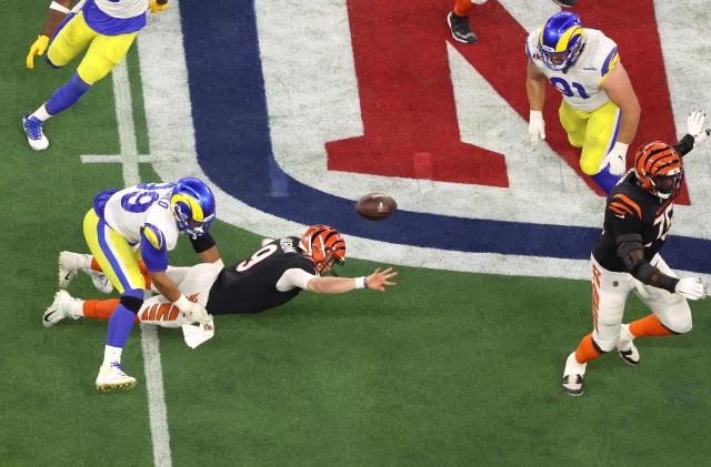 American Football  - NFL - Super Bowl LVI - Cincinnati Bengals v Los Angeles Rams - SoFi Stadium, Inglewood, California, United States - February 13, 2022   Rams defensive lineman Aaron Donald sacks Bengals quarterback Joe Burrow on the final play REUTERS/Mario Anzuoni