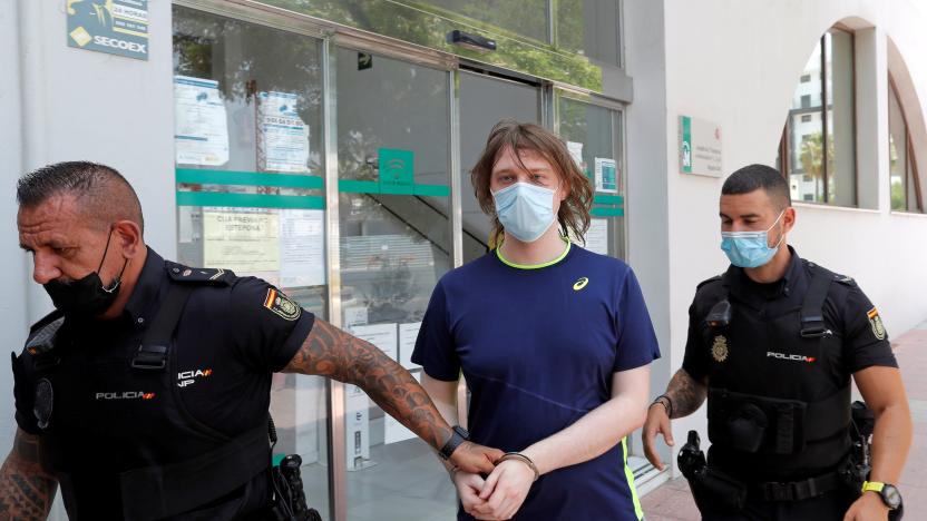 22-year-old British citizen Joseph James O'Connor is lead by Spanish police officers as he leaves a court after being arrested in connection with an alleged July 2020 Twitter hack which compromised the accounts of high-profile politicians and celebrities, according to the U.S. Justice Department, in Estepona, Spain, July 22, 2021. REUTERS/Jon Nazca