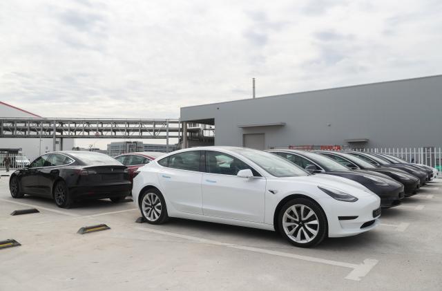 SHANGHAI, Oct. 26, 2020 -- Photo taken on Oct. 26, 2020 shows the Tesla China-made Model 3 vehicles at its gigafactory in Shanghai, east China. U.S. carmaker Tesla announced Monday that it will export 7,000 vehicles of made-in-China Model 3 to Europe on Tuesday.
    The batch of sedans is expected to arrive at the port of Zeebrugge in Belgium by sea at the end of November, before being sold in European countries including Germany, France, Italy, Spain, Portugal and Switzerland.
    Tesla delivered the first batch of made-in-China Model 3 sedans to the public earlier this year, one year after the company broke ground on its first overseas plant. (Photo by Ding Ting/Xinhua via Getty) (Xinhua/Ding Ting via Getty Images)