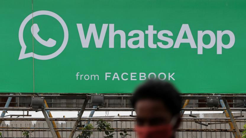 A man walks past a hoarding of the WhatsApp application installed at a skywalk in Mumbai, India, August 26, 2021. REUTERS/Francis Mascarenhas