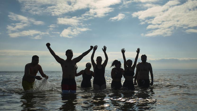 Revelers enter the cold water during the annual Polar Bear Plunge on New Year's Day, Monday, Jan. 1, 2024, in New York. (AP Photo/Andres Kudacki)