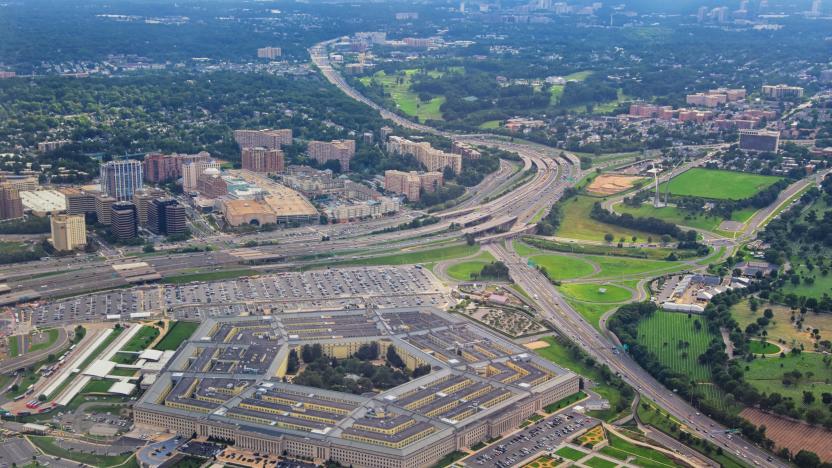 Aerial view of the United States Pentagon, the Department of Defense headquarters in Arlington, Virginia, near Washington DC, with I-395 freeway and the Air Force Memorial and Arlington Cemetery nearby.