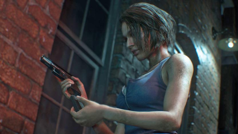 A still image of the video game character Jill Valentine in 'Resident Evil 3' remake loading a handgun next to a brick wall.