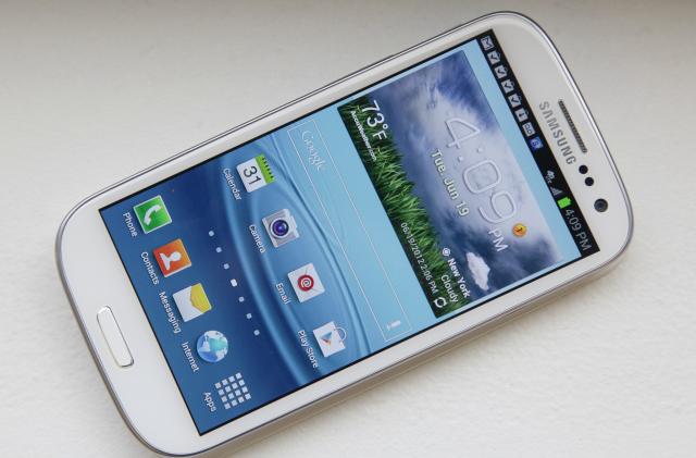 This June 19, 2012 photo shows Samsung’s new Galaxy S III phone, in New York. The Galaxy S III, which looks and feels like an oversized iPhone, is available next week. (AP Photo/Bebeto Matthews)