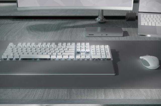 Razer's Pro Type Ultra keyboard and Pro Click Mini mouse on top of the Pro Glide XXL mousepad.