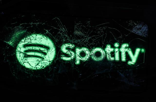 Spotify logo displayed on a phone screen is seen through a broken glass in this illustration photo taken in Krakow, Poland on February 14, 2022. (Photo by Jakub Porzycki/NurPhoto via Getty Images)