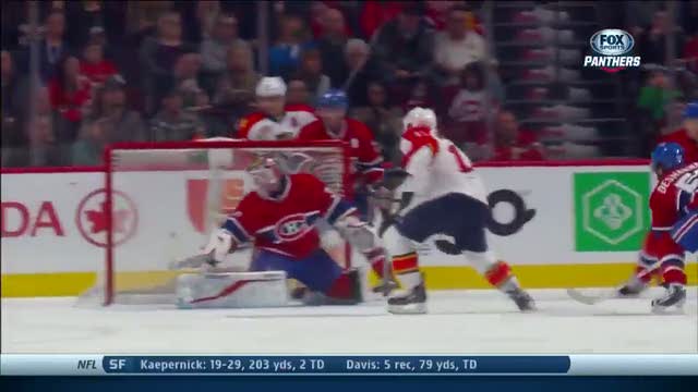 Jesse Winchester gets puck past Peter Budaj