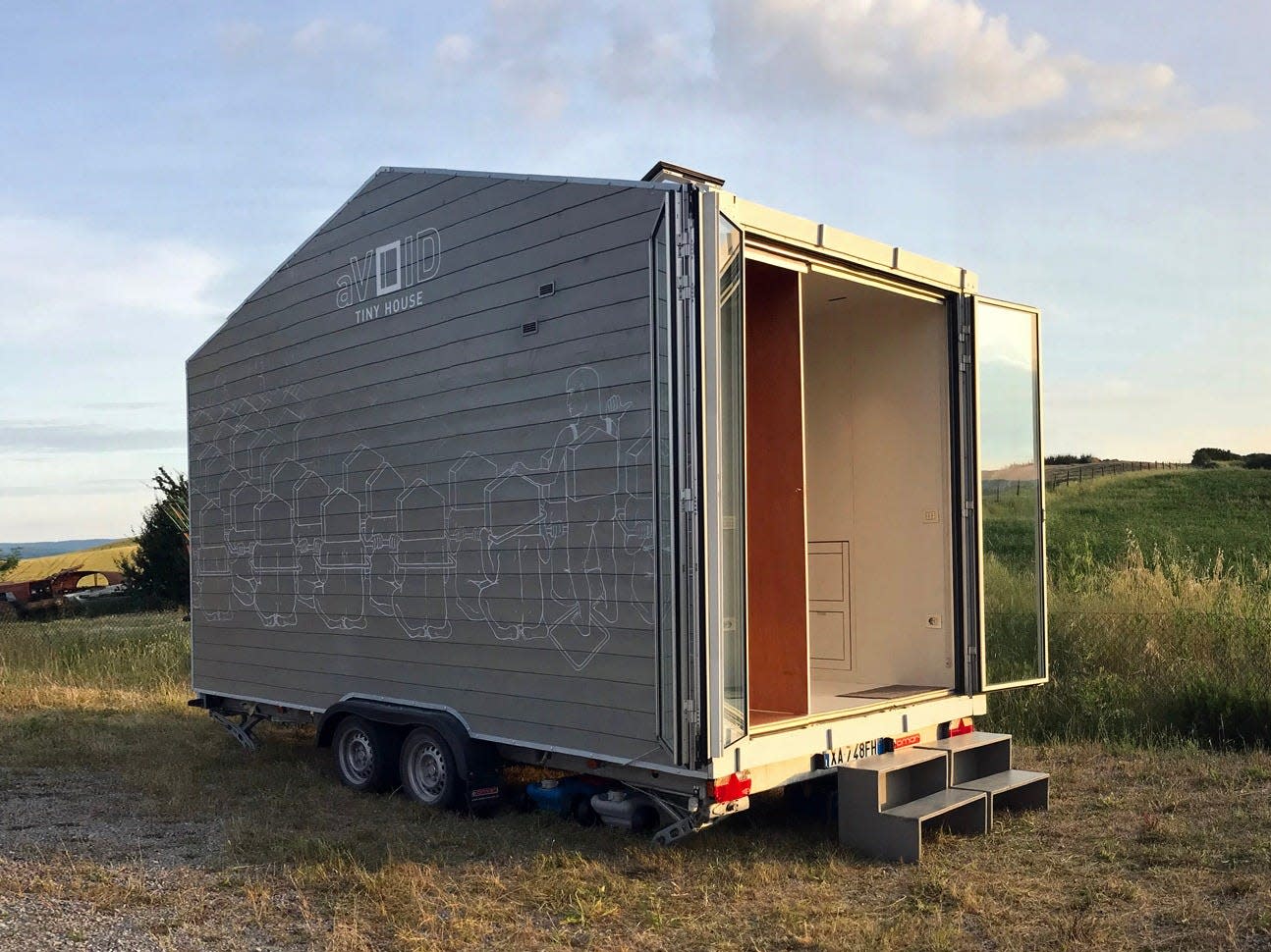 This 97-square-foot tiny home on wheels has all of its furniture stored in the walls to save space — see inside the ,000 minimalist aVOID