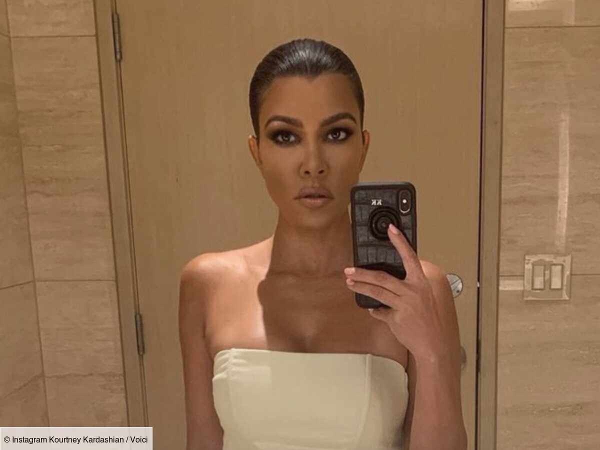 Kourtney Kardashian poses in a tiny bikini that doesn’t hide much