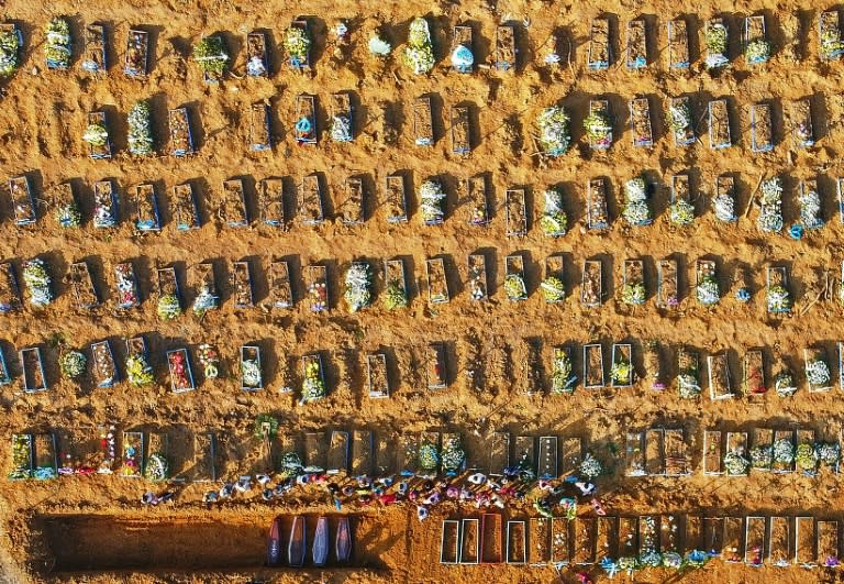 An aerial view of Parque Taruma cemetery in Manaus, with coffins of known and suspected COVID-19 victims lined up for burial in mass graves (AFP Photo/MICHAEL DANTAS)