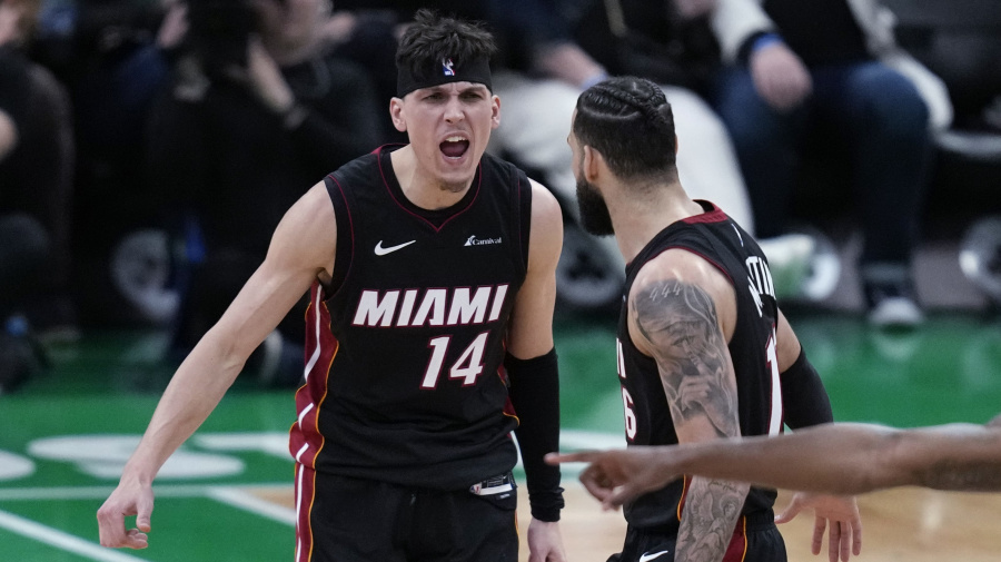 Associated Press - Miami Heat guard Tyler Herro (14) celebrates with Caleb Martin late in the second half Game 2 of the team's NBA basketball first-round playoff series against the Boston Celtics, Wednesday, April 24, 2024, in Boston. (AP Photo/Charles Krupa)