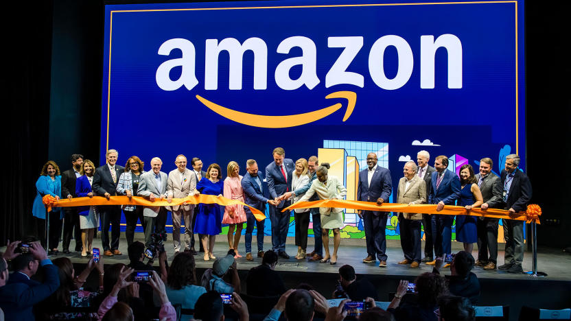 Amazon staffers joyfully cut a ribbon (with Virginia governor Glenn Youngkin) at a ceremony for its second headquarters.
